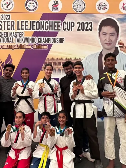 The joy of victory. Our students proudly display their medals for the camera.
