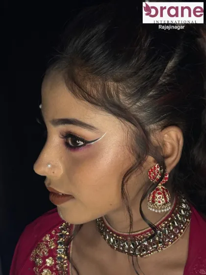 An airbrush makeup look with creative white liner details, perfect for a high-fashion or editorial shoot.