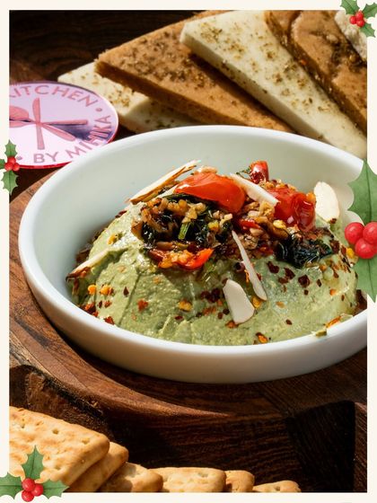 My green Caprese dip served with crackers and pita, showing off the festive colours of Christmas.