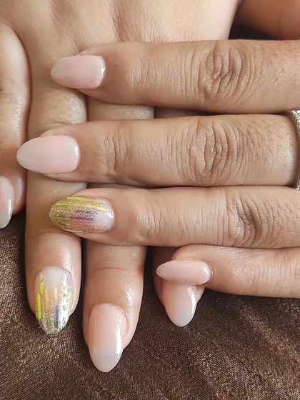Here I combined a simple nude polish with two accent nails featuring a gold and silver holographic foil effect for a pop of shine.