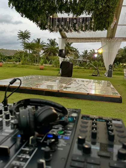 The calm before the party. Here’s my professional DJ setup overlooking a beautiful outdoor dance floor, all set for a wedding reception and afterparty. I handle all the technical details so you can focus on celebrating.