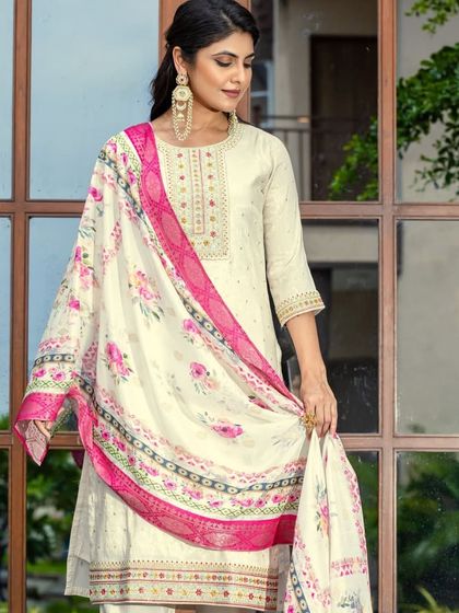 A cream viscose jacquard kurta with a vibrant printed dupatta. The mix of textures and prints makes this a really interesting and stylish outfit.