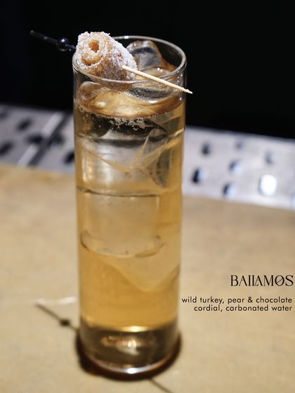 The Bailamos, a unique and intriguing cocktail with Wild Turkey bourbon, a pear & chocolate cordial, and carbonated water for a fizzy finish.