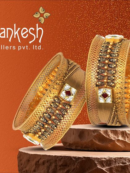 Another view of our stunning broad kadas. The combination of antique finish, red stones, and intricate patterns makes them a sophisticated and royal addition to any collection.