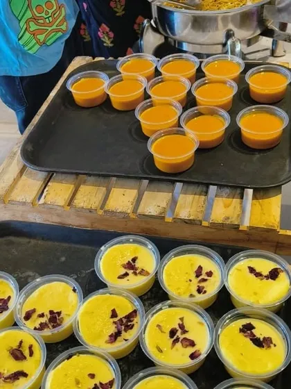 We capture the taste of summer with our fresh, preservative-free desserts. This setup for a house warming party features our popular Aamras and creamy Rasmalai, garnished with rose petals.