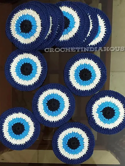 A bulk order of my popular evil eye crochet coasters, ready to be shipped. These are a great way to add a protective and stylish element to your home decor.