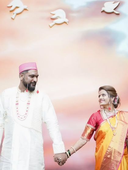 A beautiful candid moment as the couple walks hand-in-hand, sharing a look of love.