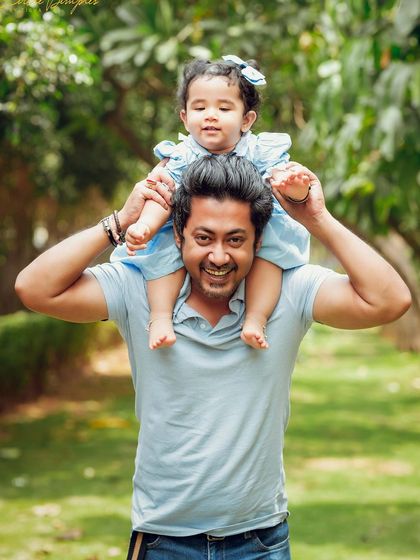 The pure joy on a father's face while giving his daughter a shoulder ride. These are the happy, unscripted moments I love to capture.