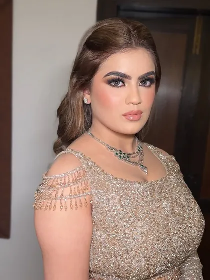 A side profile showing the beautiful contour and highlight. I avoid overly nude lips that can wash someone out, opting for a balanced peachy-nude instead.