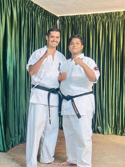 A moment with one of my black belt students during the camp. We are a family.