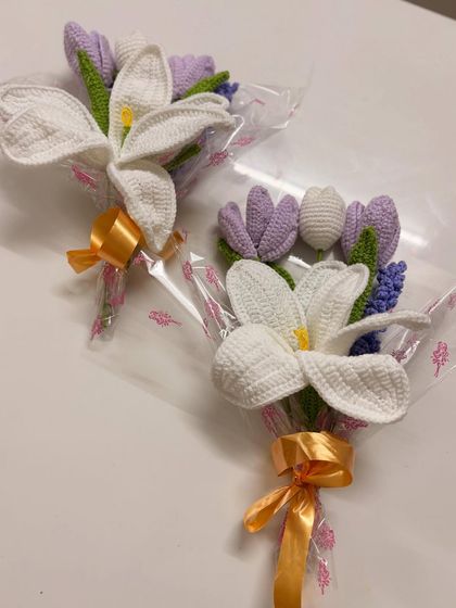 A beautiful and elegant option, this bouquet features a large white lily paired with smaller purple tulips and lavender. It's perfect for someone who appreciates classic floral beauty.