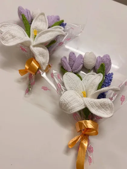 A beautiful and elegant option, this bouquet features a large white lily paired with smaller purple tulips and lavender. It's perfect for someone who appreciates classic floral beauty.