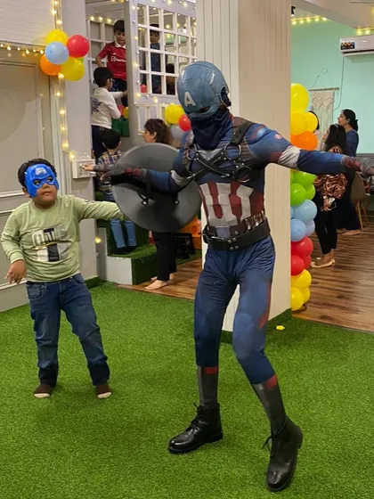 Captain America playing with a young fan. These interactive moments are what make our mascot experiences so special.