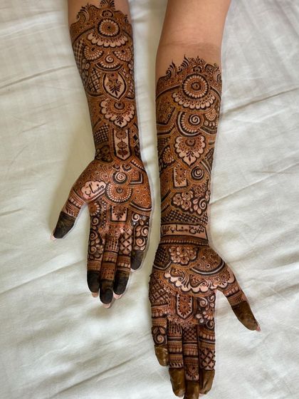 A posed shot of the engagement mehendi, showing how it complements the hands.
