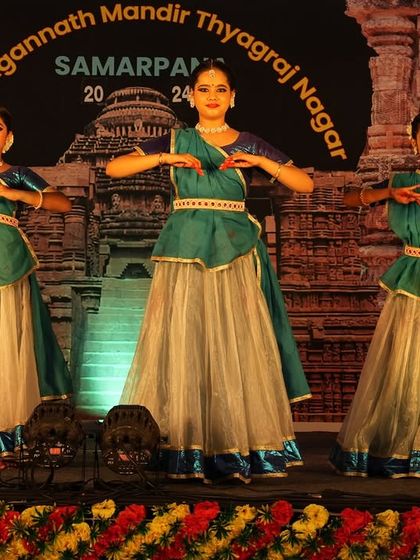 A synchronized pose from my students' group performance. Teaching them the importance of unity and precision on stage is a key part of my choreographic process for group dances.