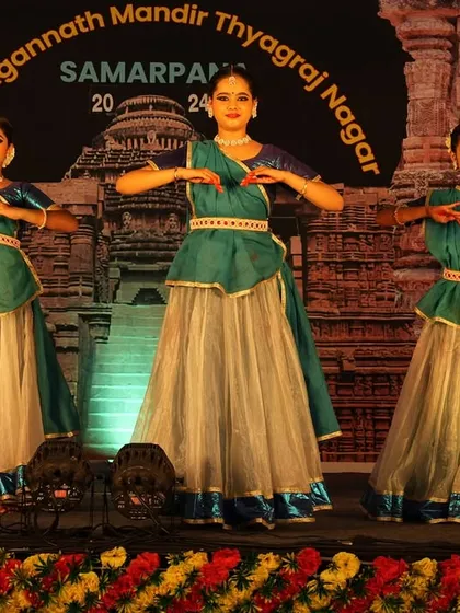 A synchronized pose from my students' group performance. Teaching them the importance of unity and precision on stage is a key part of my choreographic process for group dances.