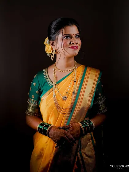A stunning portrait of the bride against a dark background, making her features pop.