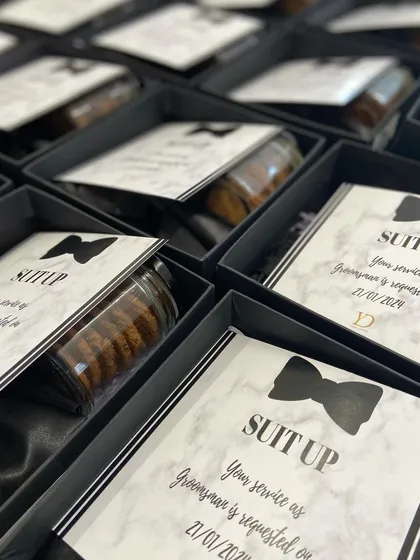 Getting the groomsmen ready to celebrate. Our 'Suit Up' invitation boxes are a stylish way to ask them to be part of the big day, featuring a sleek design and curated essentials for the main men.
