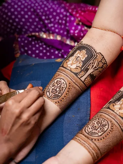A close-up of a spiritual design in progress, featuring a beautifully detailed portrait of Lord Ganesha.