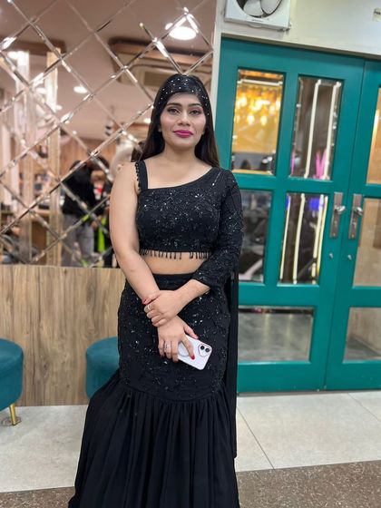 Another shot of the black saree look, showing how the embellished headband adds a touch of sparkle to the hairstyle.