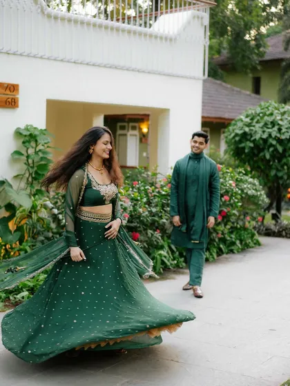 A candid moment of movement and grace. The twirl of the lehenga adds a beautiful, dynamic element to this pre-wedding photograph.