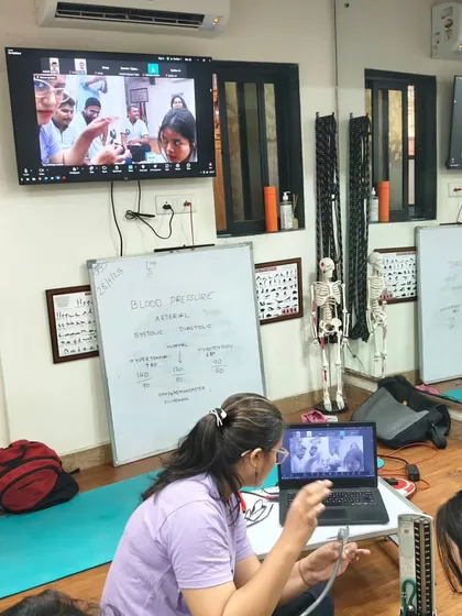 A close-up of our hybrid class in session, with online and offline students learning together during a practical naturopathy lesson.