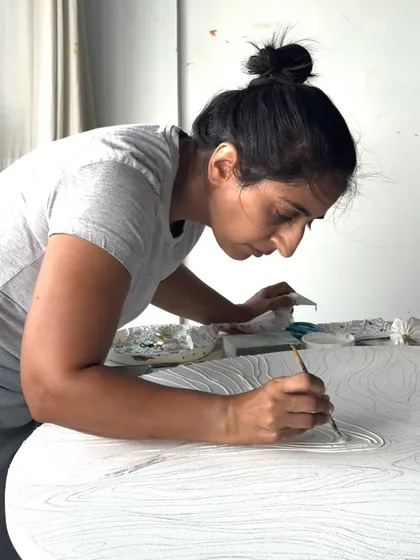 A close up of the intricate work that goes into each piece. Every line is intentionally placed to contribute to the overall flow and story of the artwork.