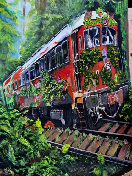 A close-up of a gouache painting of a train in a forest. Gouache is an opaque watercolor that allows for vibrant colors and detailed work, as seen in the lush foliage.