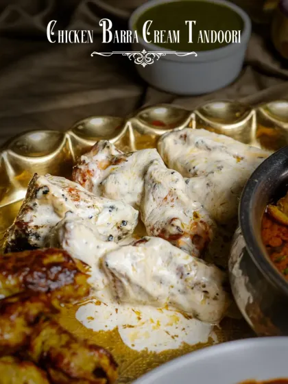 A highlight from the Dostana Thaal: Chicken Barra Cream Tandoori. Smoky chicken pieces are grilled and then lavished with a rich, creamy sauce.
