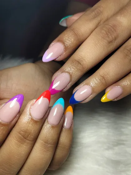 Why stick to one color? This playful design puts a colorful twist on the classic French manicure, with each nail tip painted in a different vibrant shade.