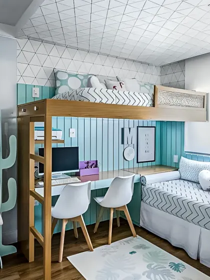 For shared rooms where space is a premium, we design solutions like this loft bed with a fully integrated double study area below. It provides personal zones for two children, complete with individual desk space and shelving, all within a compact and stylish footprint.