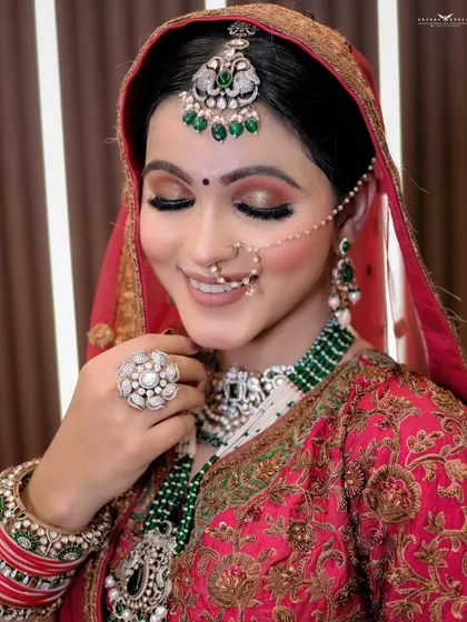 A serene portrait with the bride's eyes lowered, showcasing her eye makeup.