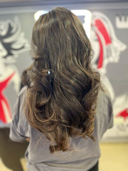 This transformation shows how a good haircut and style can bring life to your hair. I added long layers and finished with a voluminous blow dry to create these deep, flowing waves and incredible body.