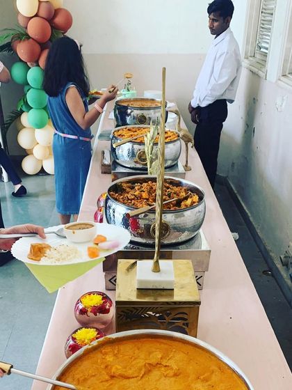 Guests being served from the buffet line by my staff. I ensure there is always a team member present to assist guests and keep the buffet tidy and well-stocked.