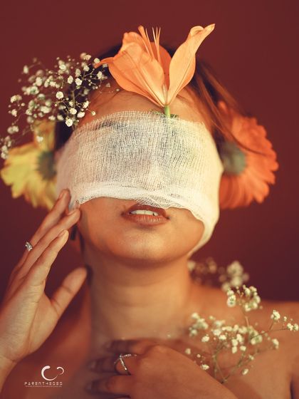 A serene and peaceful expression in this conceptual piece. The flowers seem to be an extension of her thoughts and feelings.