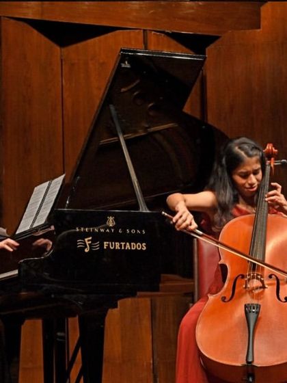 A close-up of the cellist and pianist from our Note Bene Trio, captured in a moment of intense musical dialogue during their performance.