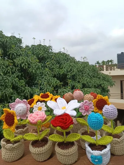 A group shot of my various potted flower designs, from roses and tulips to sunflowers.