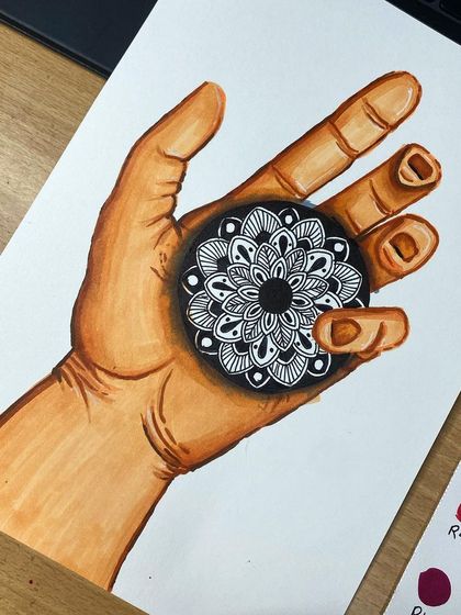 A creative piece combining figure drawing and mandala art. I used markers to draw the hand and a fine-liner for the intricate mandala held within it, showing how versatile these patterns can be.
