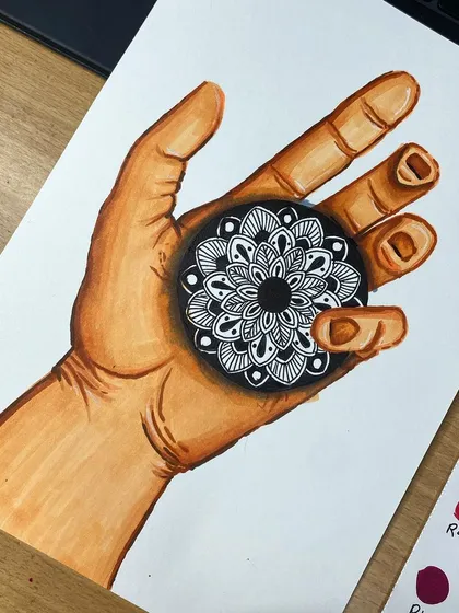 A conceptual piece combining a realistic marker drawing of a hand with a black and white mandala coaster. This 3D effect shows how my physical art pieces can be integrated into larger compositions.