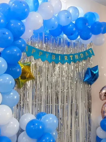 A cheerful blue and white home birthday decoration for a 2nd birthday. Our budget packages are customizable to your preferred color scheme.