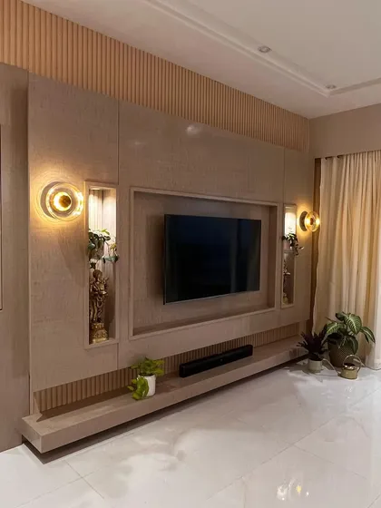 The full view of the custom TV wall unit. The floating design keeps the floor clear, making the room feel more spacious, while the combination of textures adds visual interest.