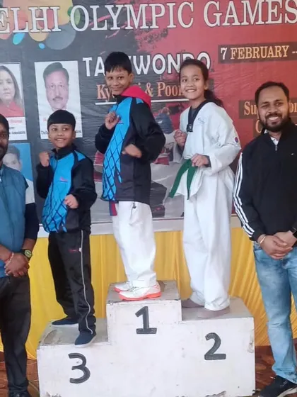 Our sub-junior champs on the winners' podium at the Delhi Olympic Games. We train kids to compete with confidence and sportsmanship.