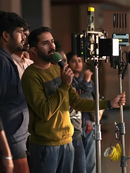 Holding the mic and camera rig, I'm right in the middle of the action. This hands-on approach allows me to guide the performers and camera operators in real-time to capture the energy of the scene.