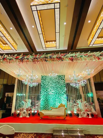 A full view of the indoor stage, showing the red carpet and the overall luxurious feel of the banquet hall.