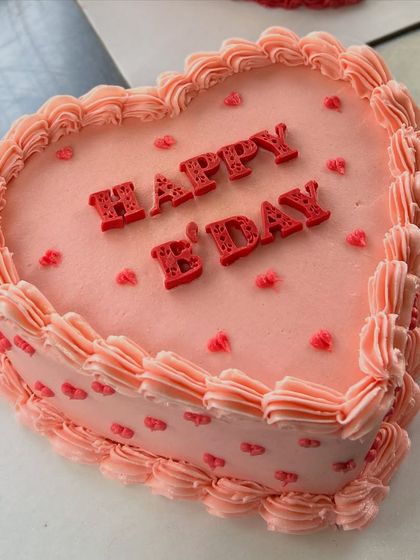 A sweet, heart-shaped cake with vintage-style piping. Perfect for birthdays, anniversaries, or just to show someone you care.