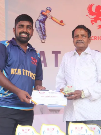 A senior player from the RCA Titans smiles as he receives his award.
