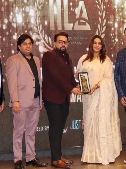 Receiving an award at the IILA ceremony. Each recognition serves as a powerful reminder of the impact our work can have.