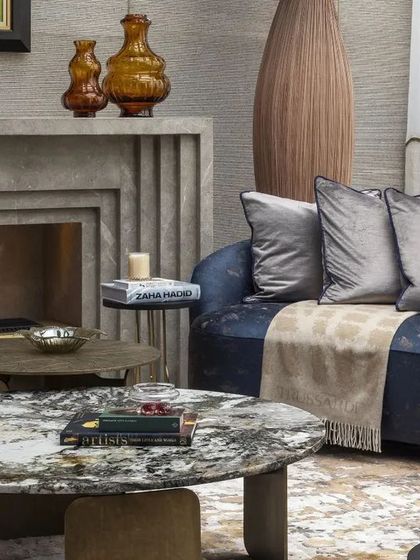 Another angle of the living space, highlighting the bespoke furniture and subtle classical details that enrich the contemporary theme. The space is defined by luxury, refinement, and integrated brass accents.