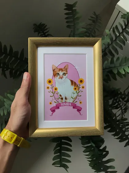 Holding the finished, framed portrait of Simba. This gives a sense of the artwork's size and how it feels to have the final, tangible piece in hand.