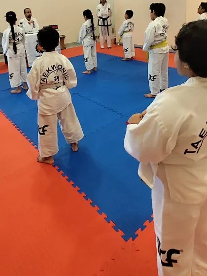 Our students line up for instruction, learning the importance of order and respect in the dojang.
